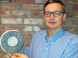 Dr. Oyston holding up a fake Quit Quarter